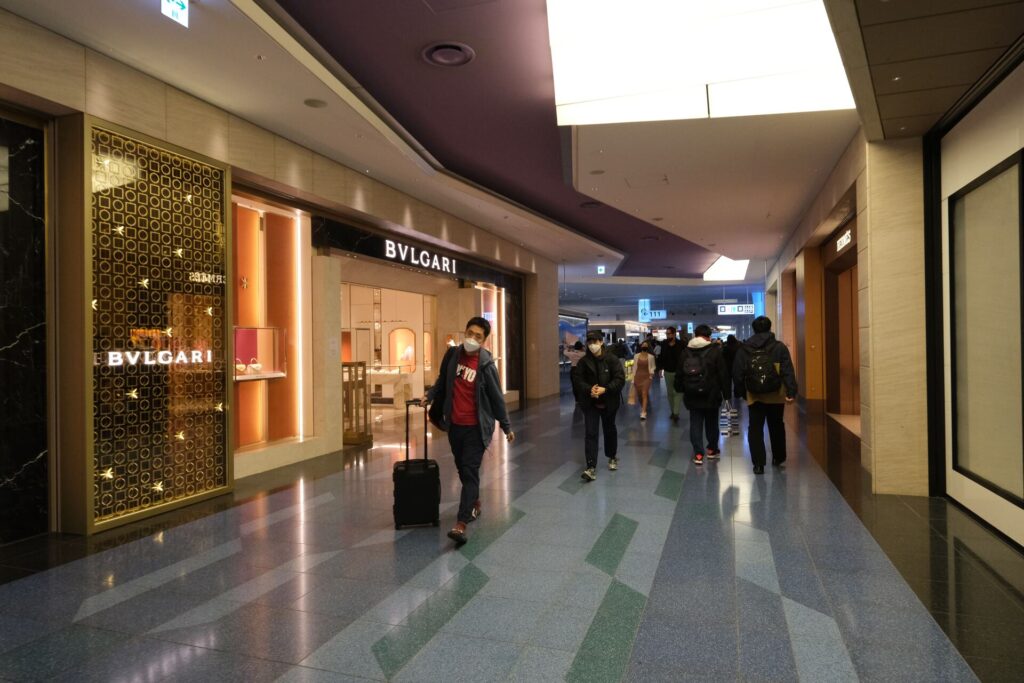 people walking round Haneda terminal
