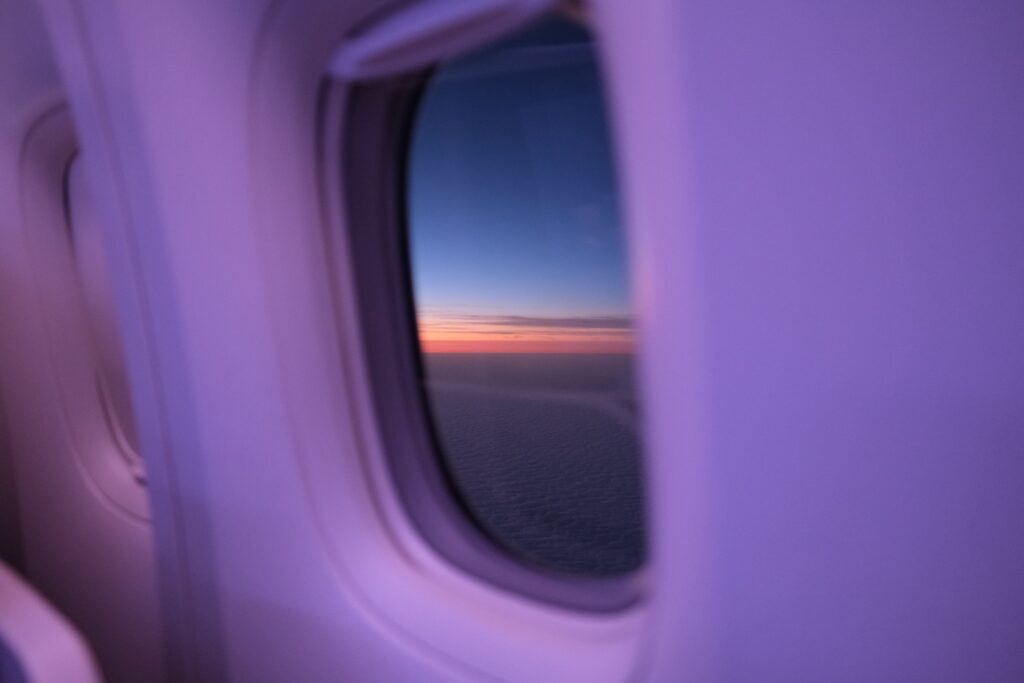 JAL first class seat window with the sunset