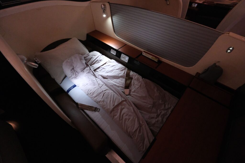 JAL first class seat in lie flat sleeping mode