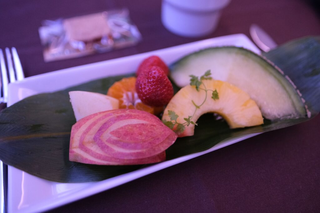 JAL Frist Class fruit breakfast Peach, apple, strawberry, pineapple, and melon fruit plate

