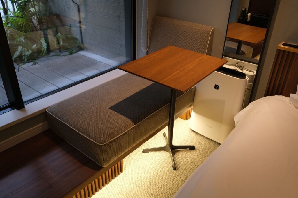 A small side sofa and working table is provided next to the bed and the terrace door. An air purifier is also provided for use, if you’d like to plug it in. The room was a little crowded with all these devices.
