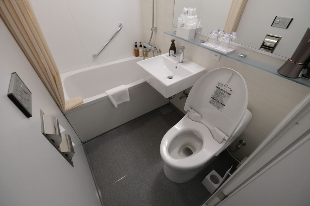 The Twin Room Bathroom is small but technologically advanced - with automatic controls for the toilet, for the ventilation and lighting.
