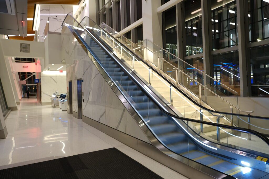 Escalators from the fast curbside check in get you to security much quicker than normal.