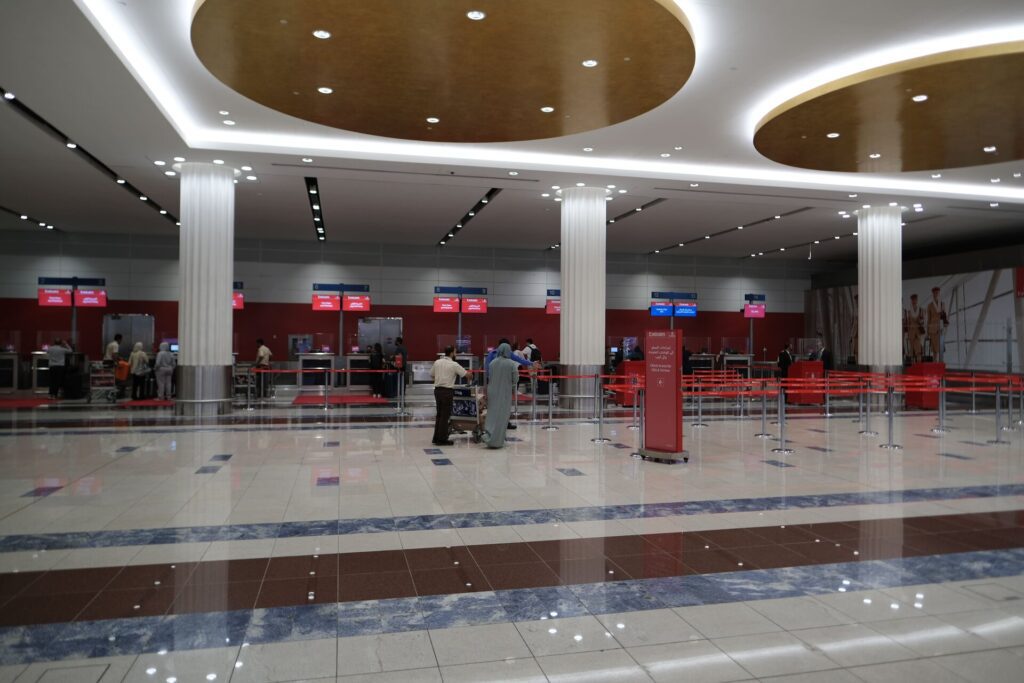 First are Check-In counters for Emirates First Class (Red) 