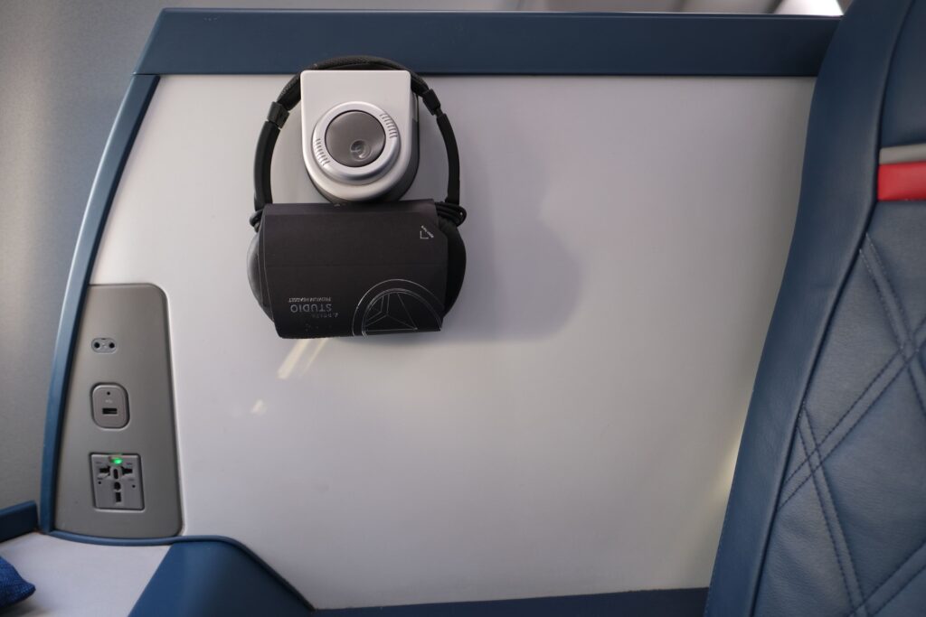 Power port and USB charging are available for your devices in this Delta One seat,  and a headset as well.