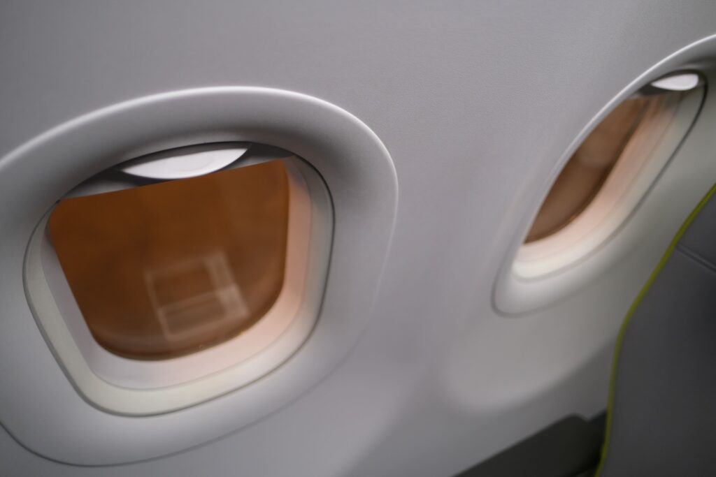 Windows are slightly off the seat placement, but you do get two (particularly in full recline).