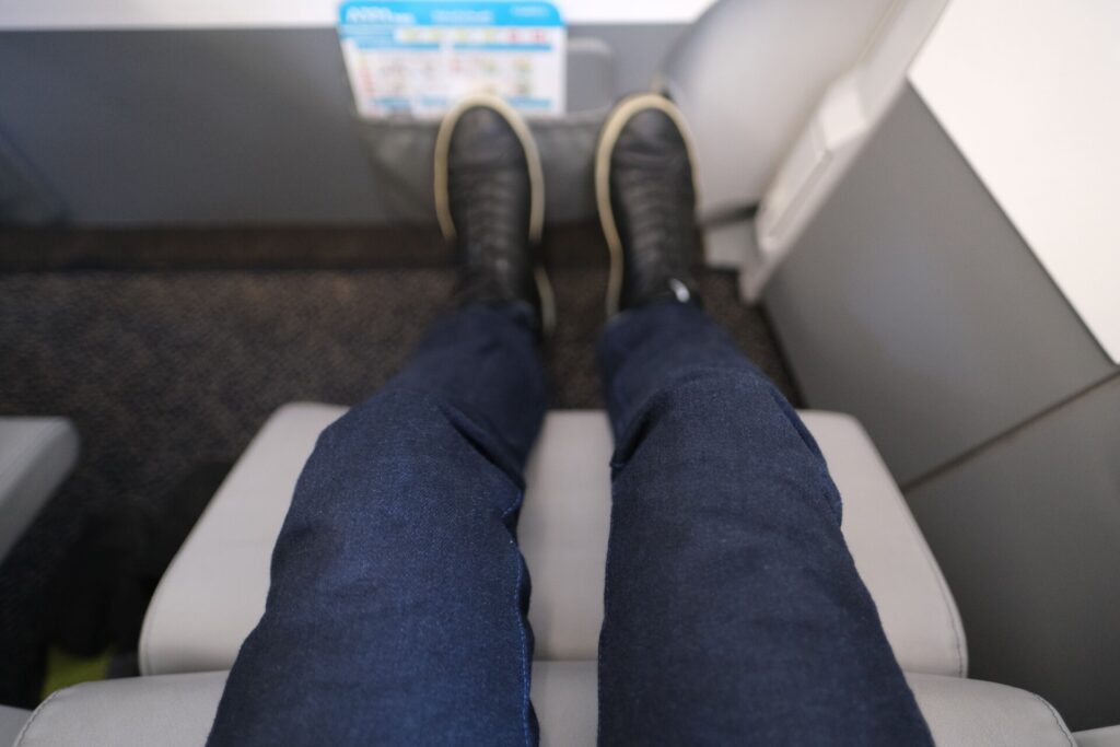 The Extended footrest basically fits my size. I'd say this is very comparable to Premium Economy on most carriers. 