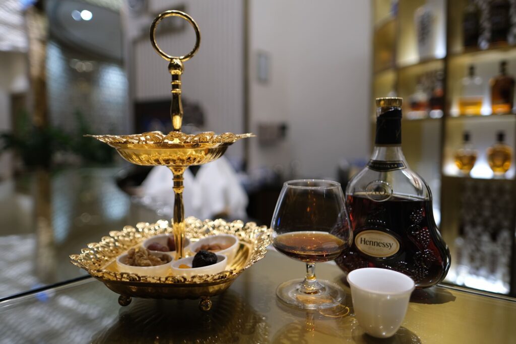 Hennessy Brandy, served with warm nuts and dates of various kinds. I also got an Arabic Coffee.