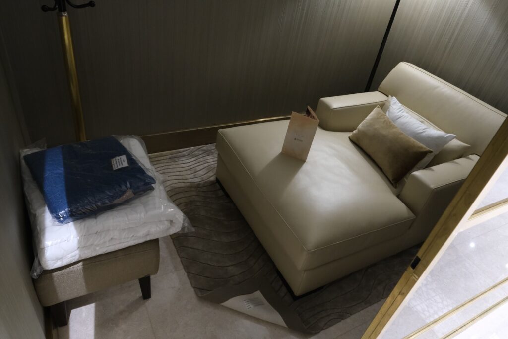 Oman Air first class lounge Private Nap room with amenity kit and PJs
