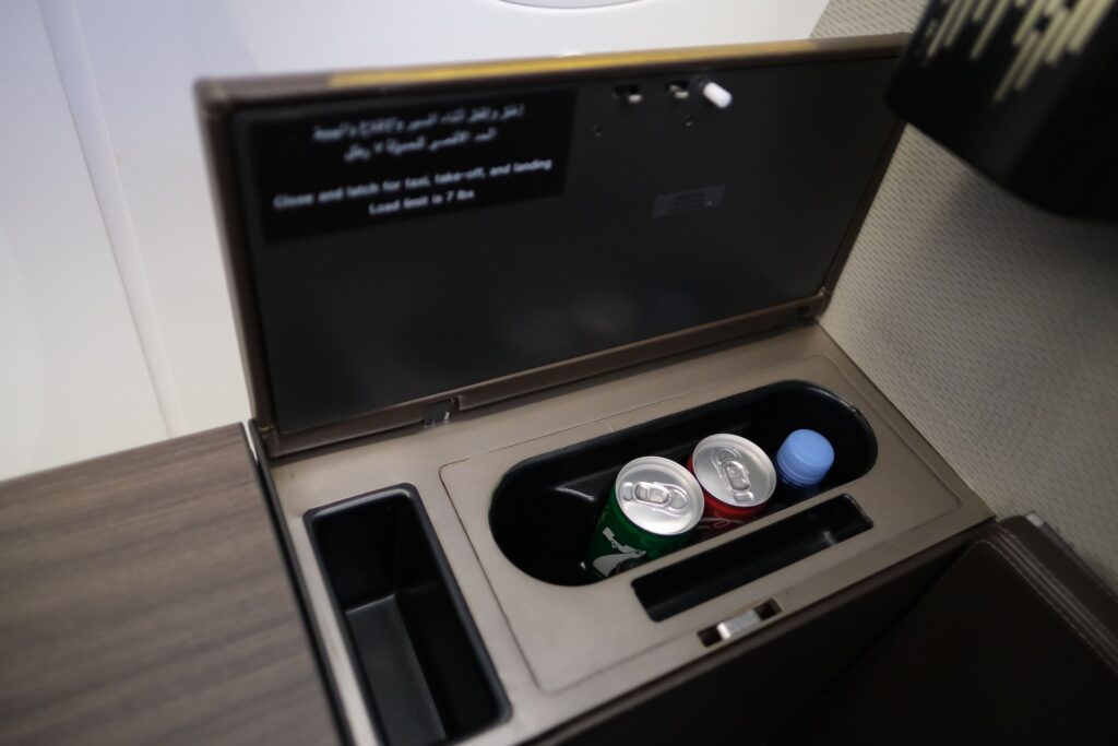 There is additional storage on the opposite corner of the seat which has some complimentary beverages,  two sodas and bottled water. 