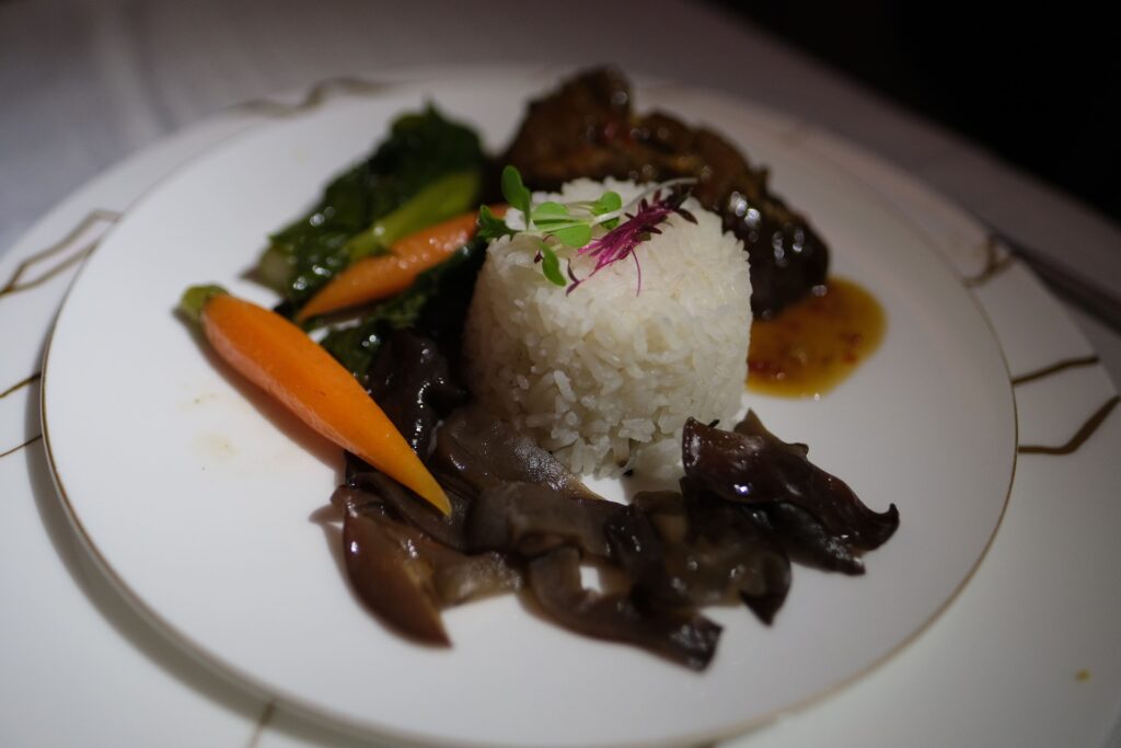 Oman air first class rice with carrots and meat dish.