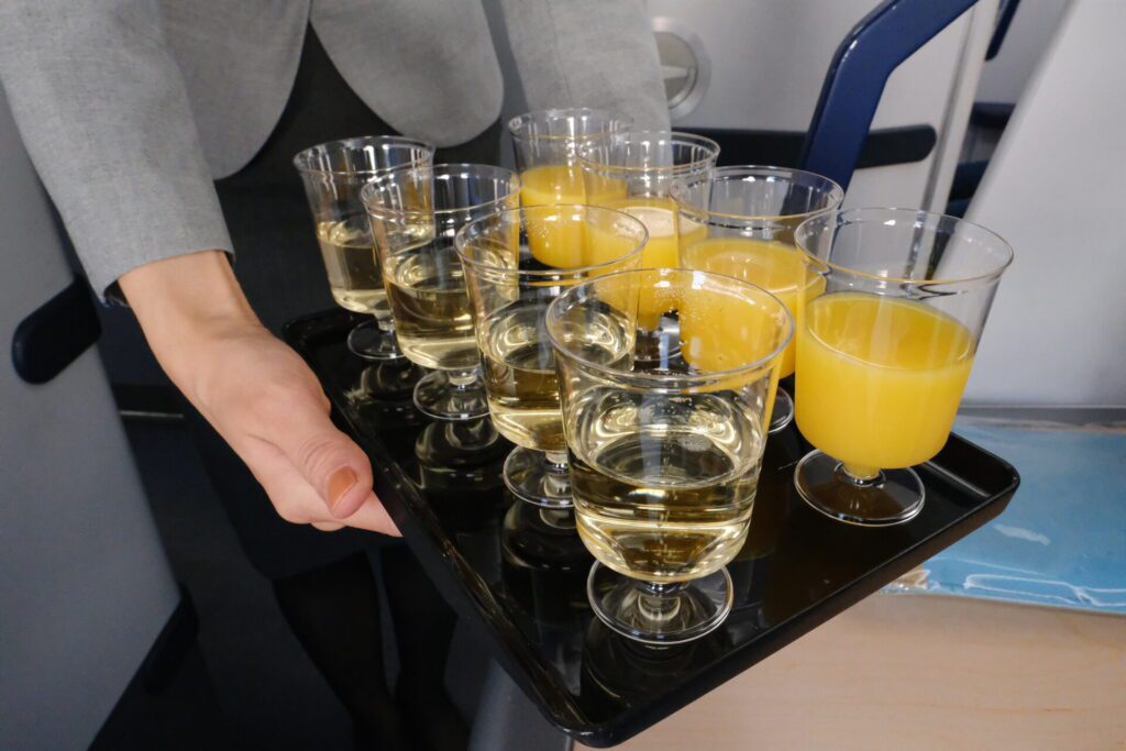 . Water and orange juice (as well as Champagne) is offered as pre-departure drinks. 