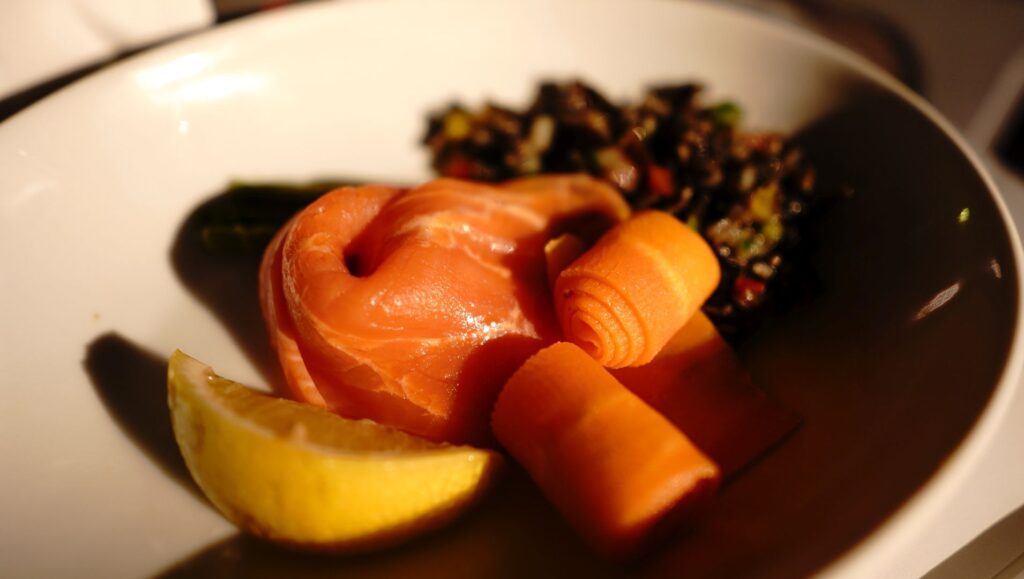 Smoked salmon, wild rice salad, asparagus, pickled carrots.