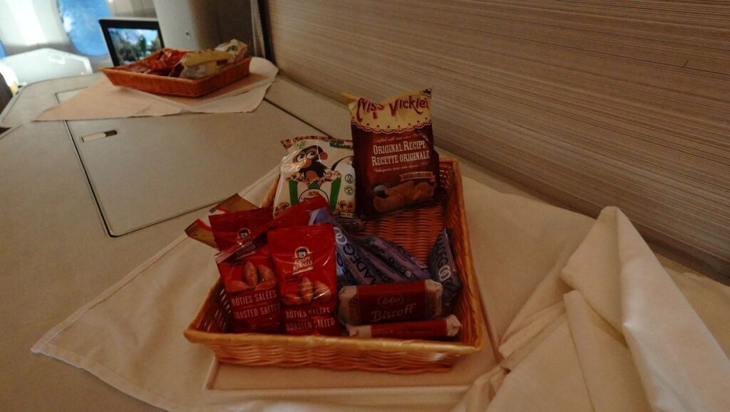 Mid flight snack tray at the front of the cabin