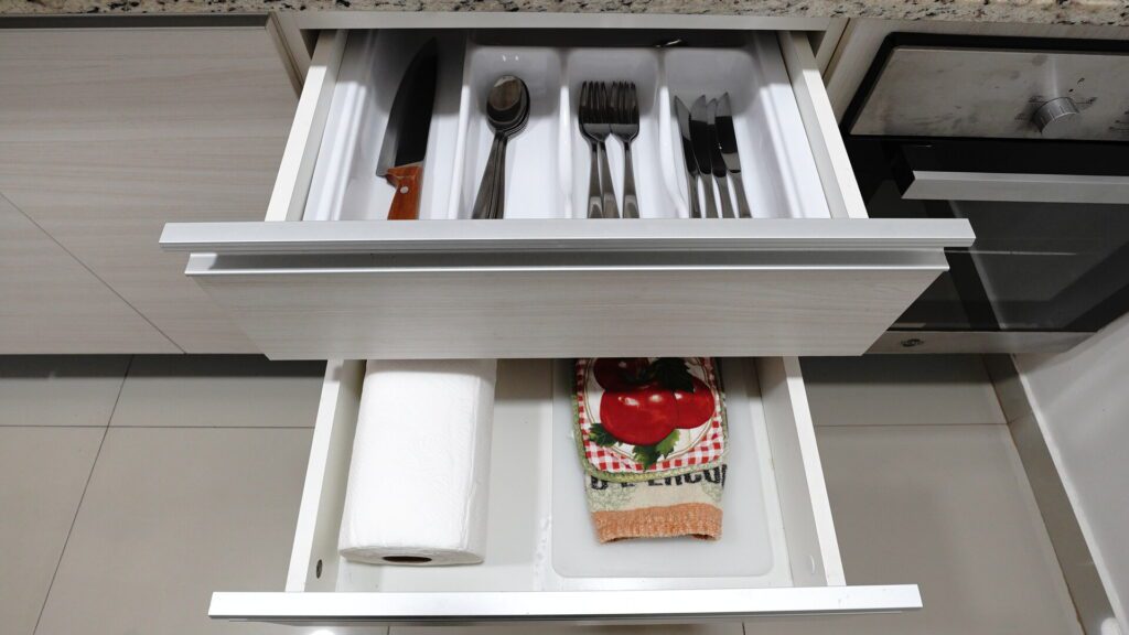 Open drawers with utensils 