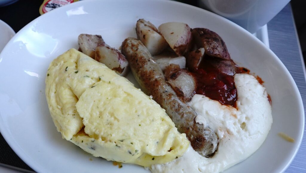 Parsley Omelet with Tomato, Sausage, and Potatoes; and a delicious cranberry sauce with cream.