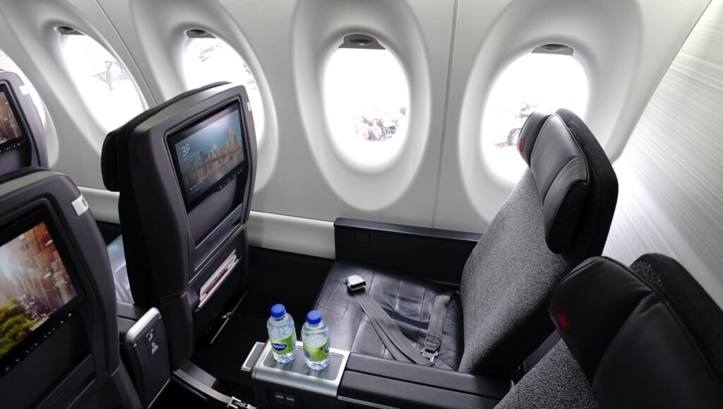 Air Canada business class seat with water botles