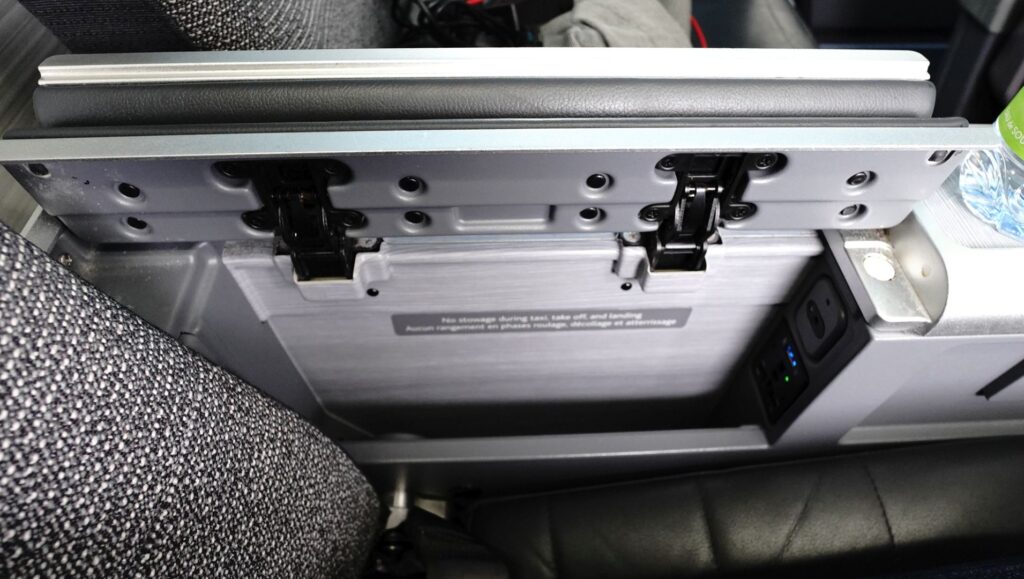 Air Canada business class center console with sockets