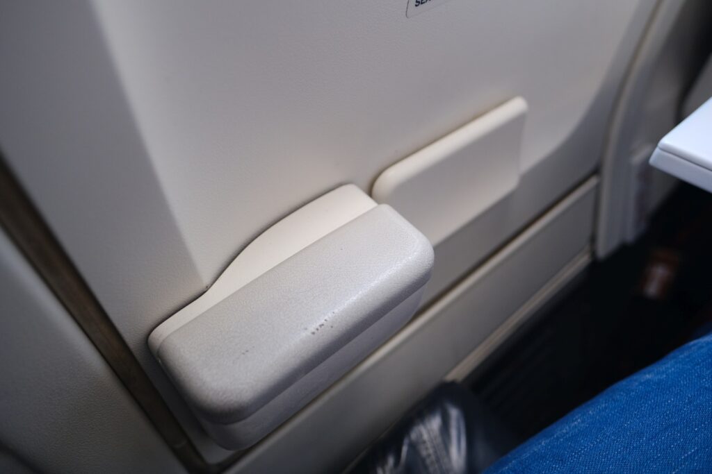 Alaska Airlines economy seat emergency exit row arm rest