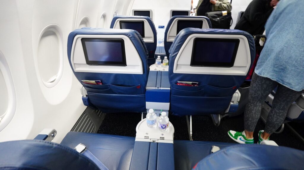 Delta domestic business class IFE screen and seat backs