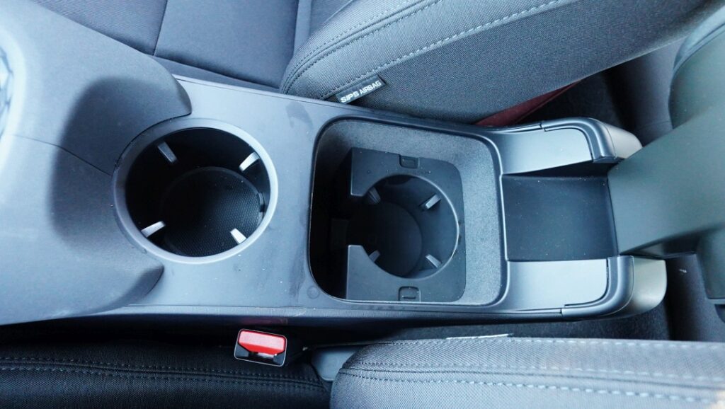 Center console cup holders - one is hidden below the cushion cover.