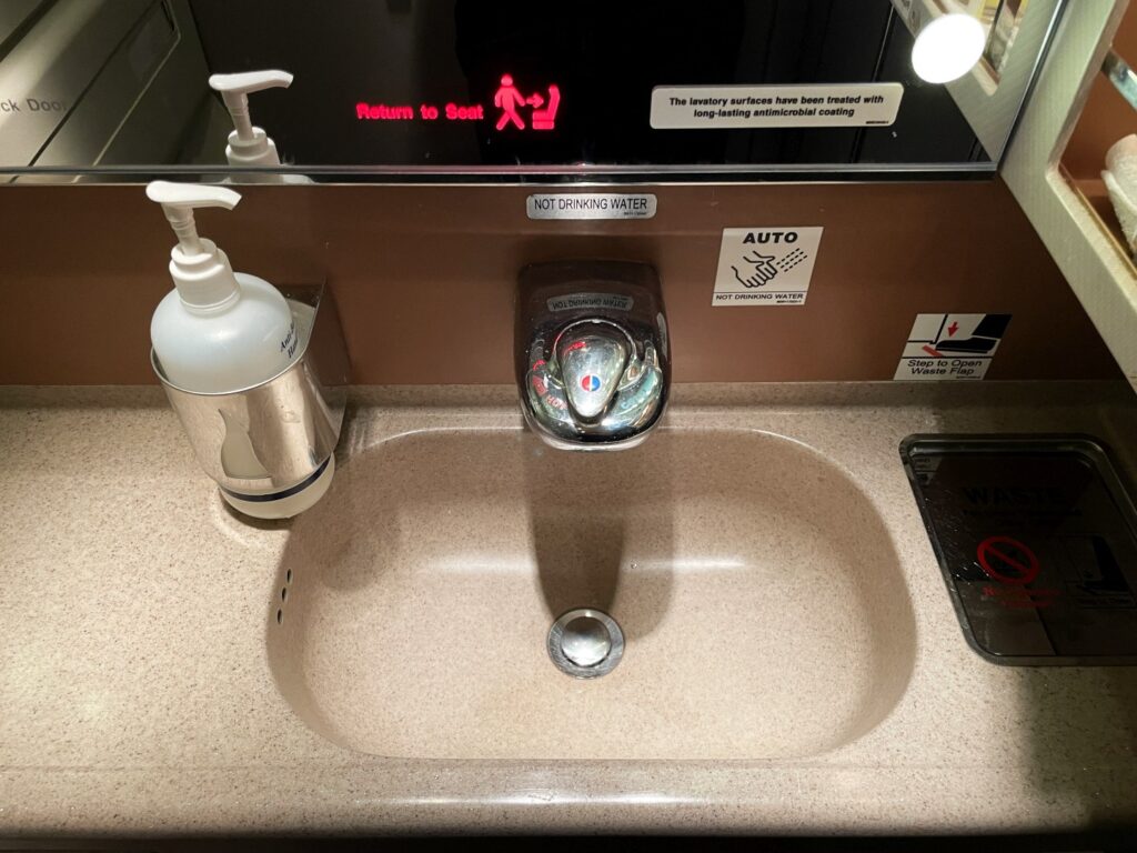 Singapore Airlines business class restroom washbasin with soap