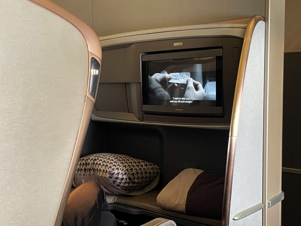The bulkhead seats in both business class cabins have a large ottoman in front