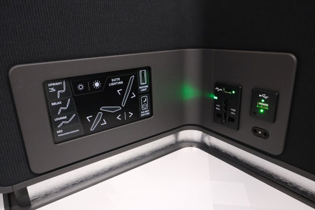 Full Delta One business class seat controls and power