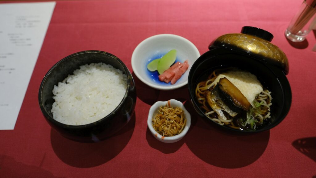 Local rice, soba noodles, and melon served after the first course