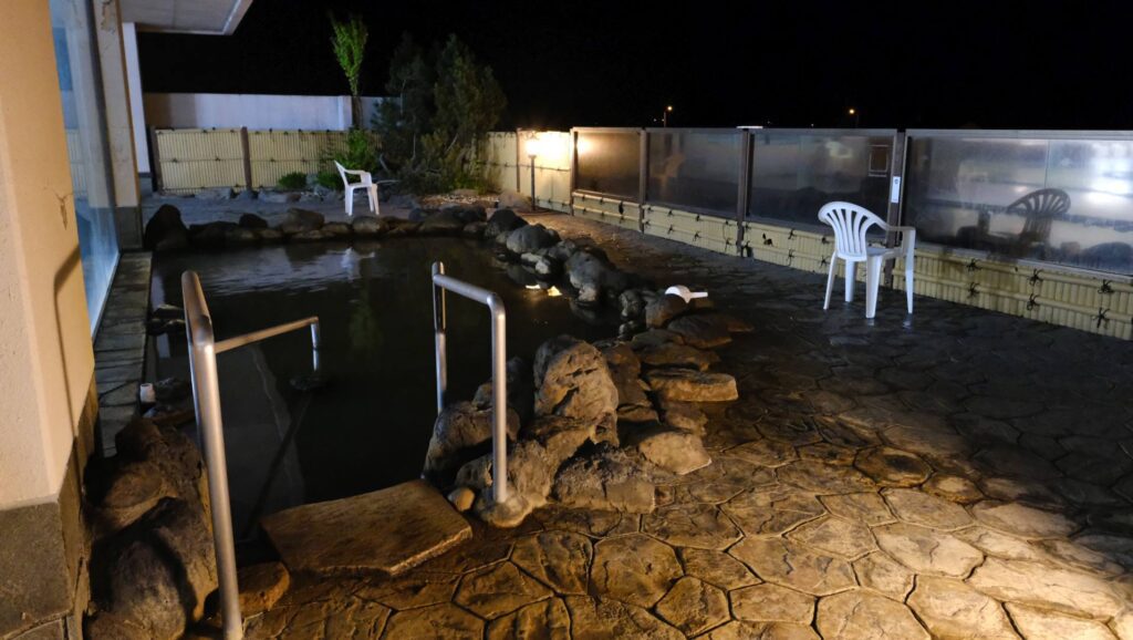 Night time view of the outdoor Onsen pools