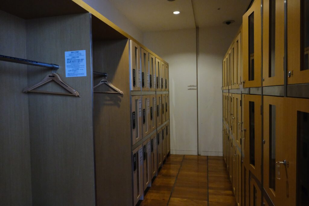 Sakura business class lounge lockers and coat hanging area