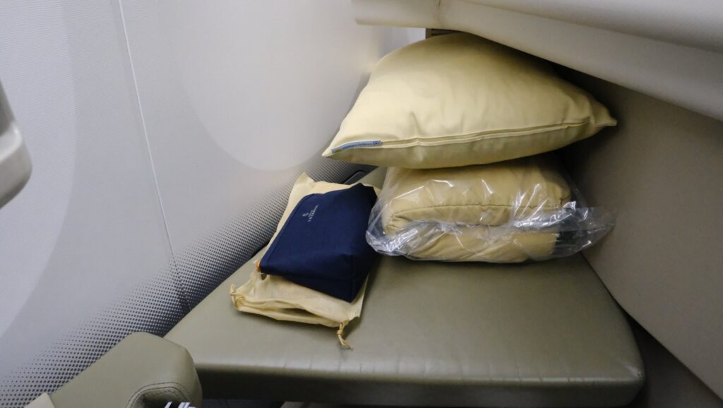 Vietnam airlines business class yellow pillow, blanket and amenity kit