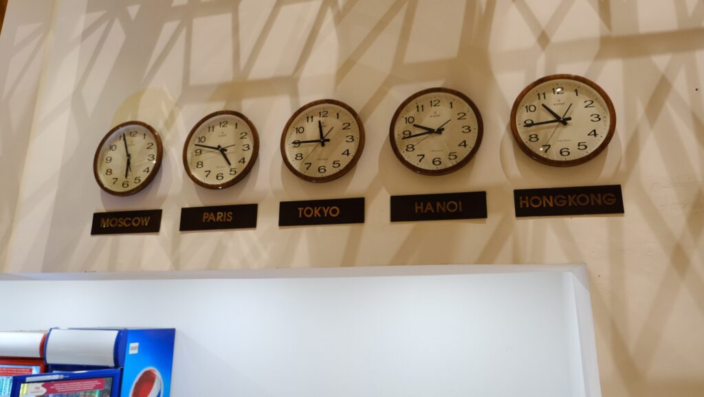 Clocks above the food service area set to various world timezone