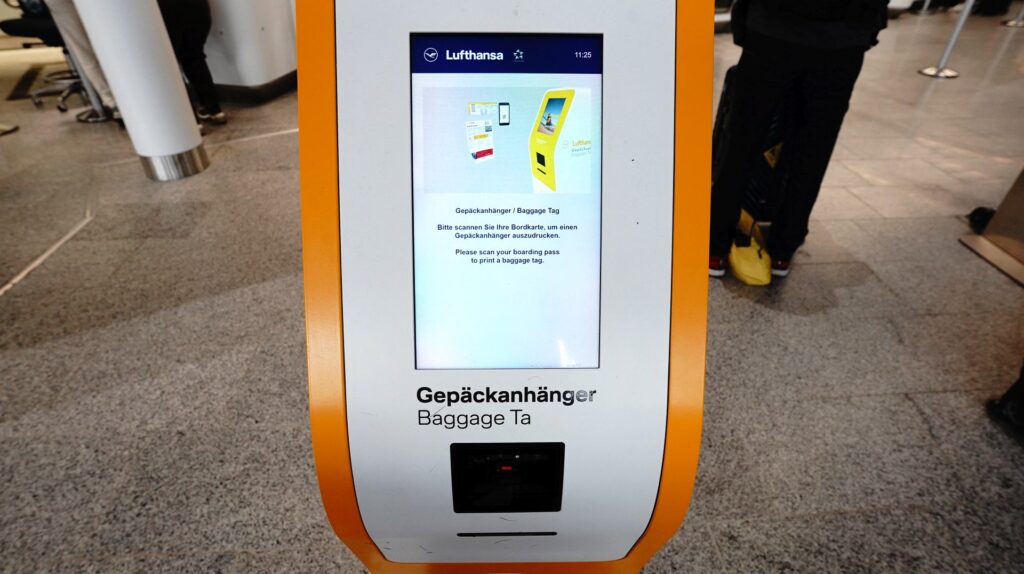 Using the automated baggage tag machines