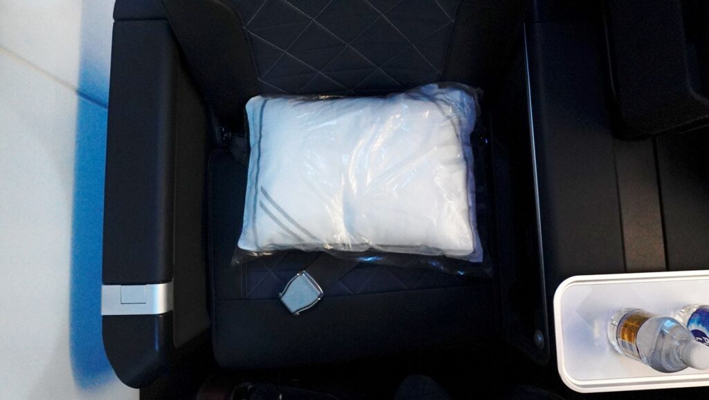 The seat came with a pillow and blanket for the flight